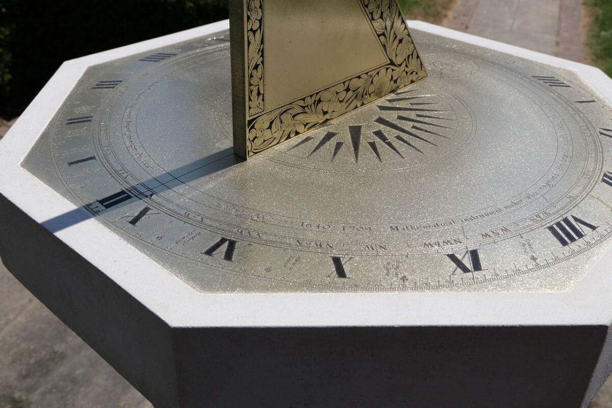 A sundial featuring Roman numerals representing the hours