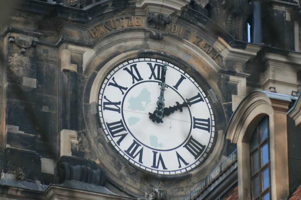 A clock featuring Roman numeral numbers
